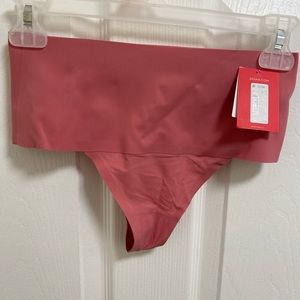 NWT SPANX undietectable thong panty. Pink size medium never worn!